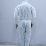 Back view of disposable white coverall suit with hood for full-body protection in medical and industrial settings.