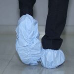 Blue disposable shoe covers with elastic fit for hygienic protection